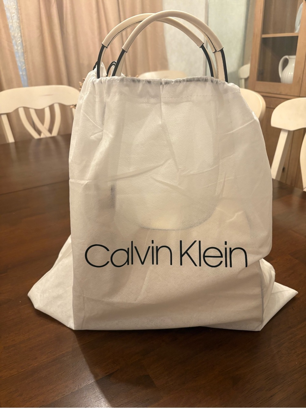 Calvin Klein purse 

Used once 
 Color : cream